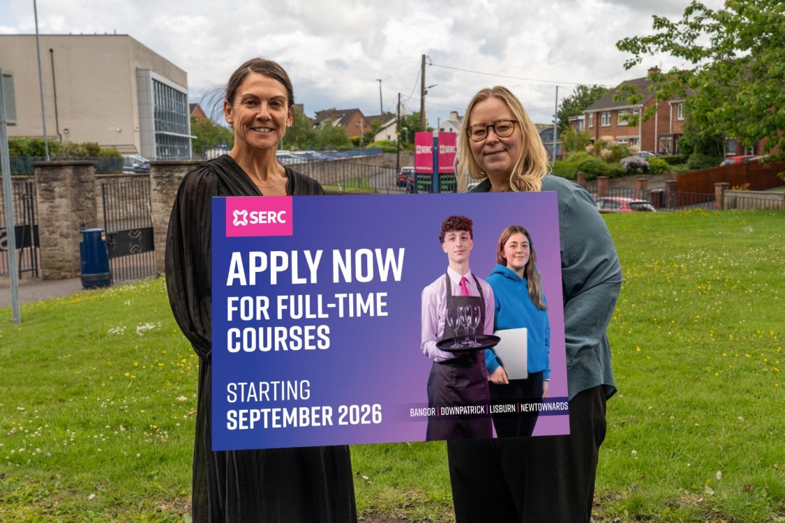 Picture of SERC careers staff holding a sign urging students to apply now